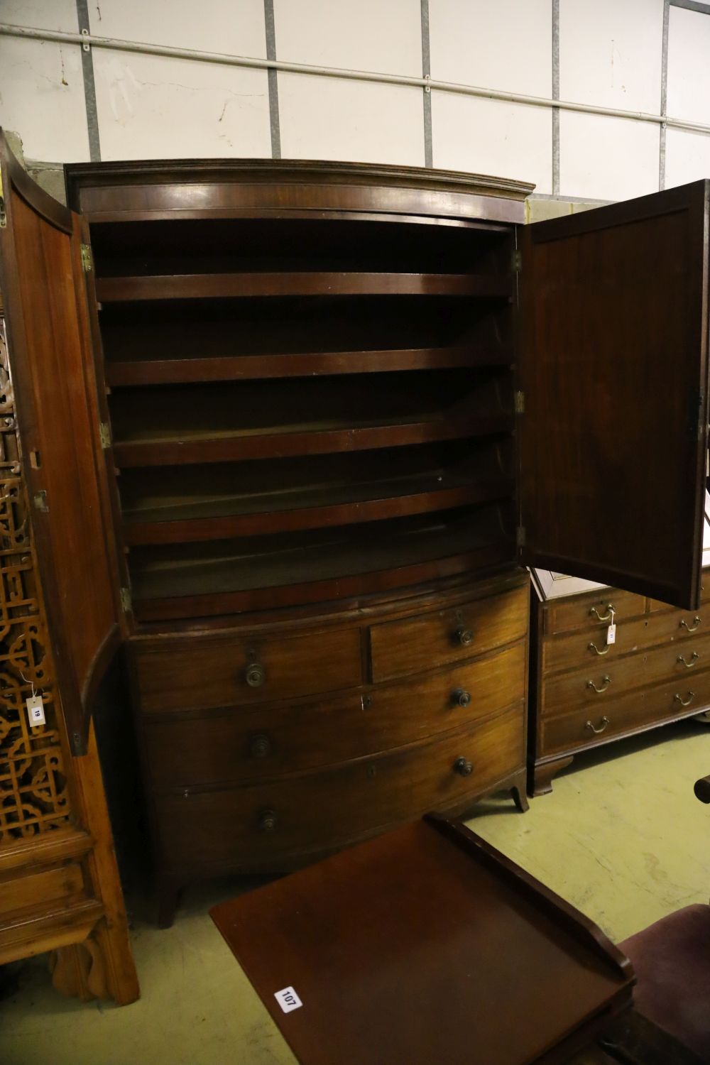 A Regency mahogany bow front linen press, width 128cm, depth 54cm, height 206cm